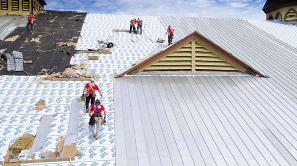 Roof replacement with crew in action
